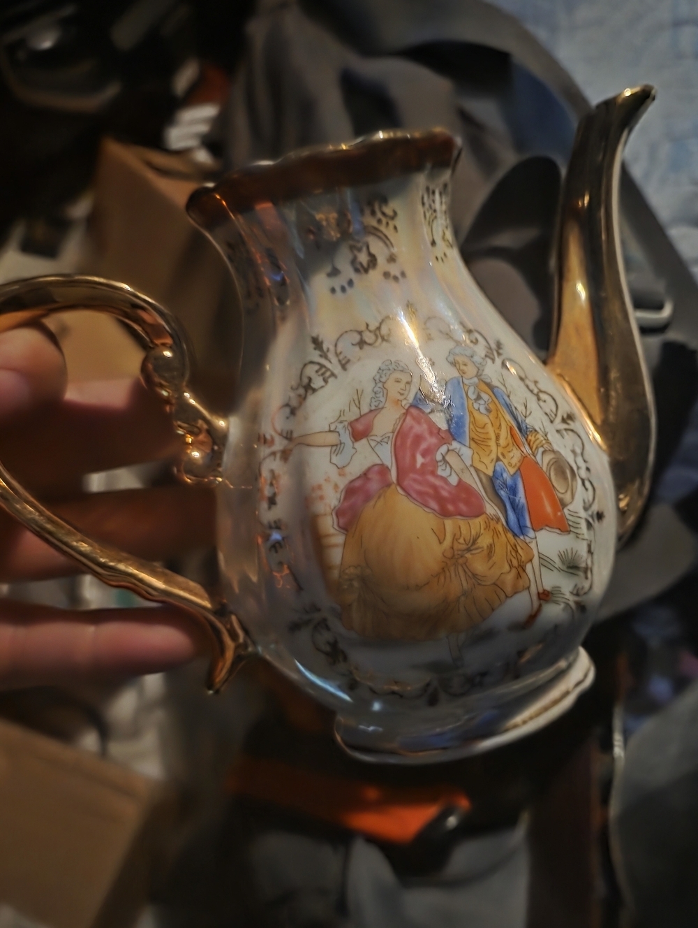 Gold-Accent Porcelain Decorative Teapot with Romantic Scene